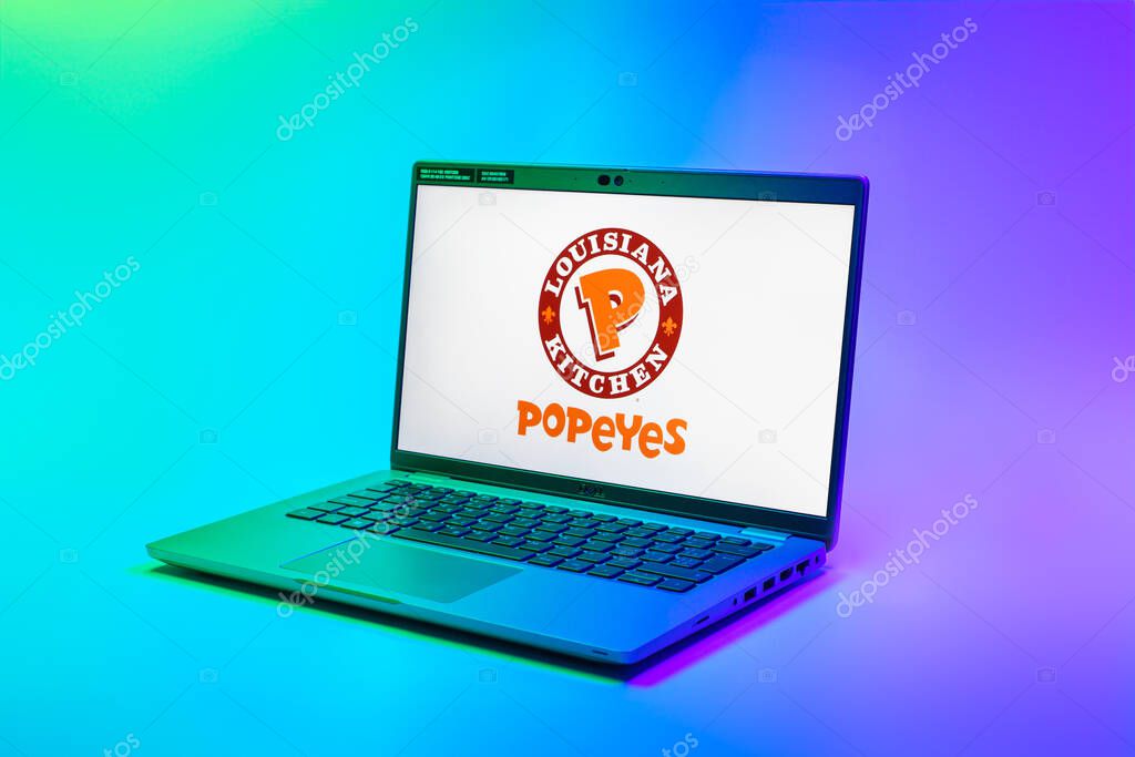 Prague, Czechia - 02 21 2025: Laptop on surface showing Popeyes logo.