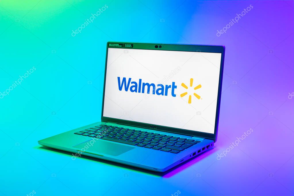 Prague, Czechia - 02 21 2025: Laptop on surface showing Walmart logo.