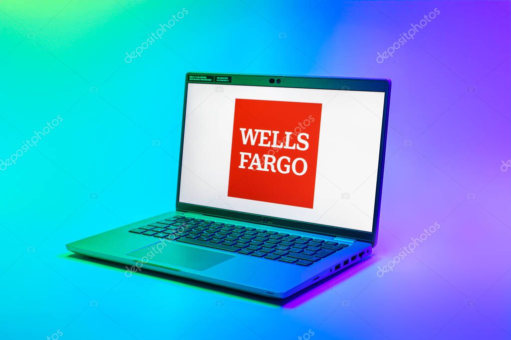 Prague, Czechia - 02 21 2025: Laptop on surface showing Wells Fargo logo.