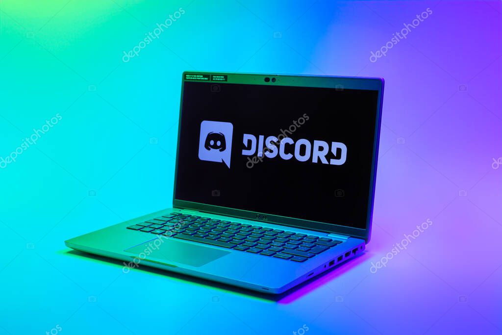 Prague, Czechia - 02 21 2025: Laptop on surface showing Discord logo.