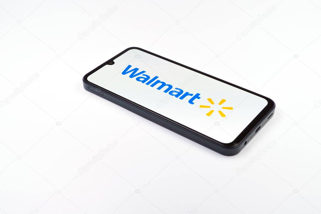 Prague, Czechia - 02 21 2025: Laptop on surface showing Walmart logo.