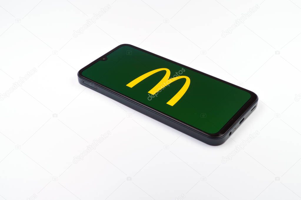 Prague, Czechia - 02 21 2025: Laptop on surface showing McDonalds logo.