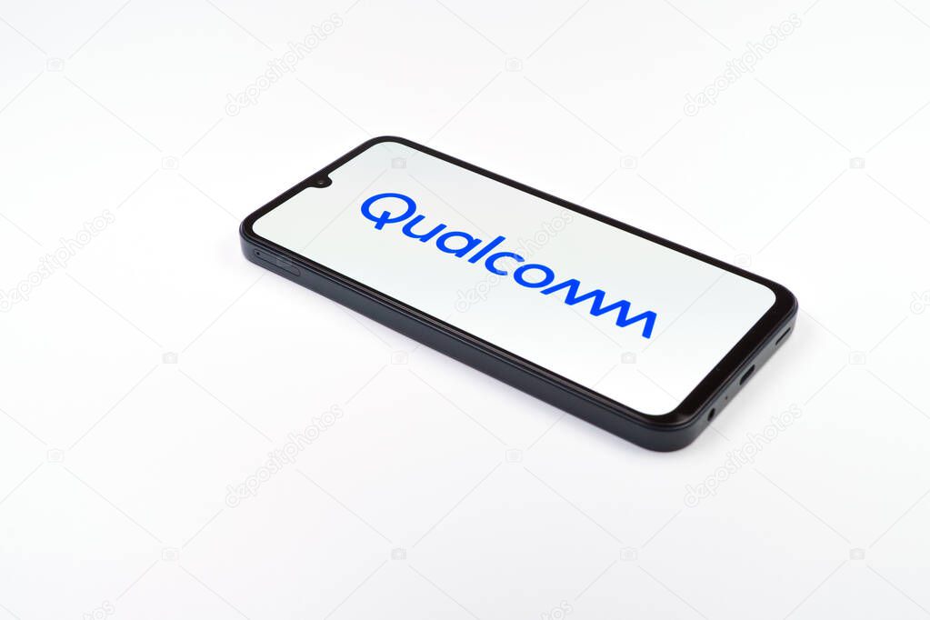 Prague, Czechia - 02 21 2025: Laptop on surface showing Qualcomm logo.