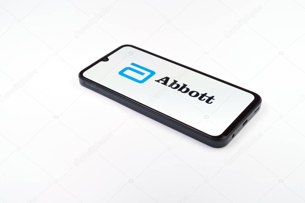 Prague, Czechia - 02 21 2025: Laptop on surface showing Abbott Laboratories logo.