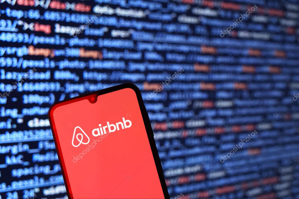 Prague, Czechia - 02 21 2025: Laptop on surface showing Airbnb logo.