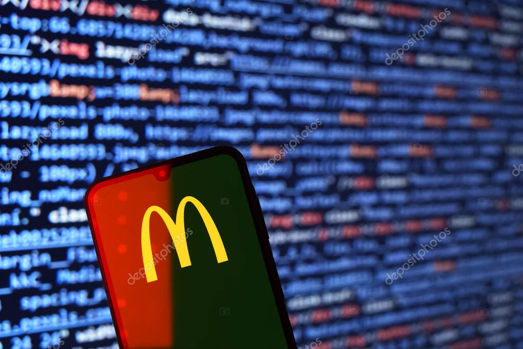 Prague, Czechia - 02 21 2025: Laptop on surface showing McDonalds logo.