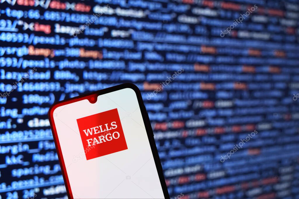 Prague, Czechia - 02 21 2025: Laptop on surface showing Wells Fargo logo.