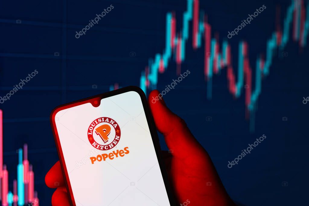 Prague, Czechia - 02 21 2025: Laptop on surface showing Popeyes logo.