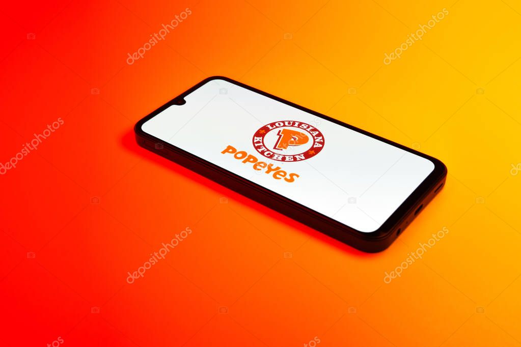 Prague, Czechia - 02 21 2025: Laptop on surface showing Popeyes logo.