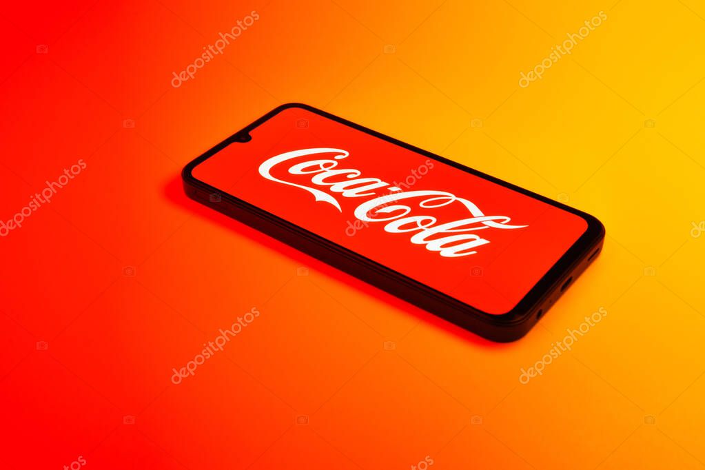 Prague, Czechia - 02 21 2025: Laptop on surface showing Coca-Cola logo.