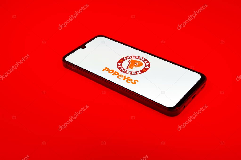 Prague, Czechia - 02 21 2025: Laptop on surface showing Popeyes logo.