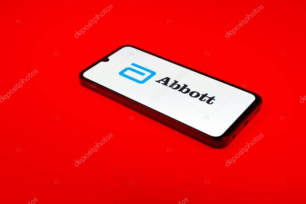 Prague, Czechia - 02 21 2025: Laptop on surface showing Abbott Laboratories logo.