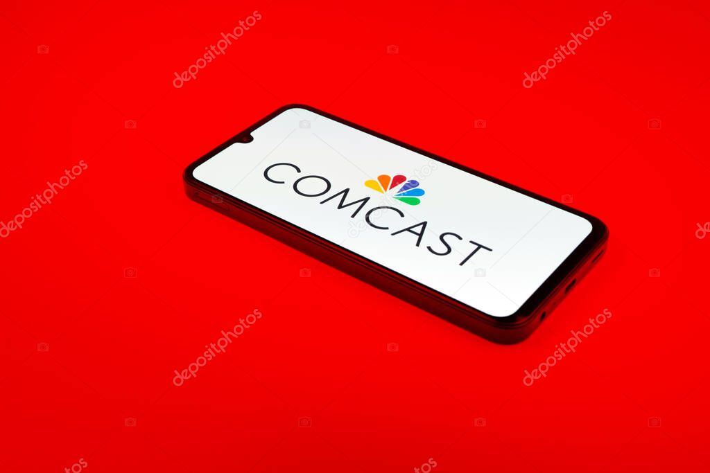 Prague, Czechia - 02 21 2025: Laptop on surface showing Comcast logo.
