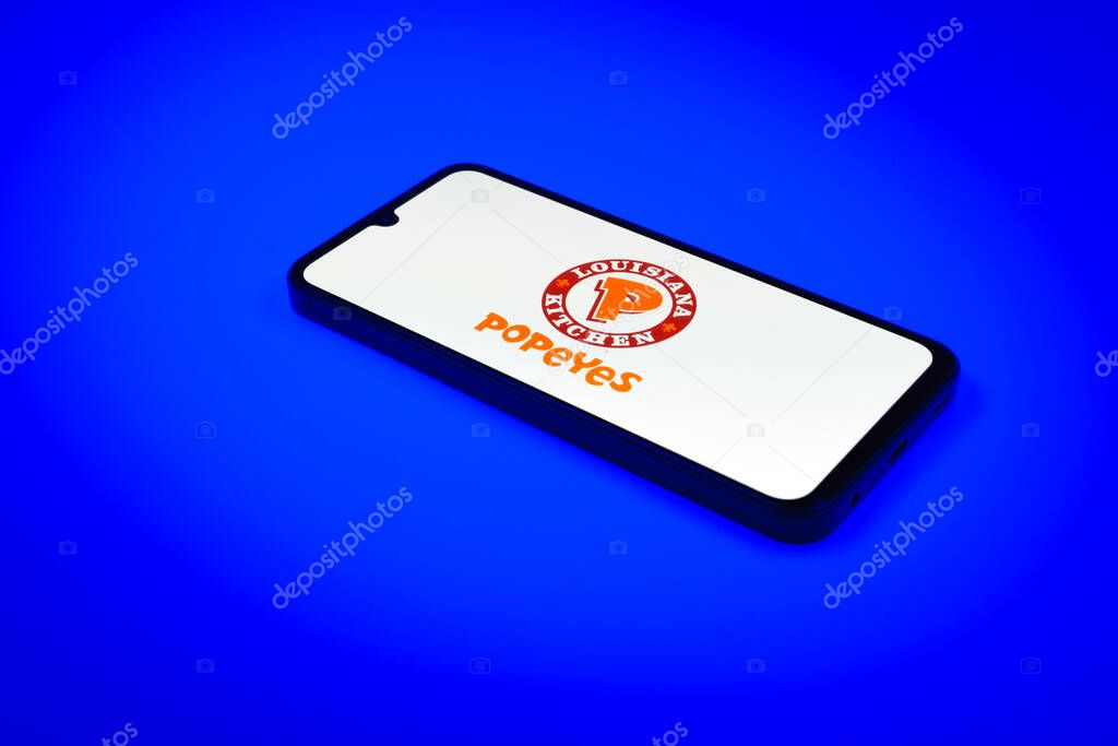 Prague, Czechia - 02 21 2025: Laptop on surface showing Popeyes logo.
