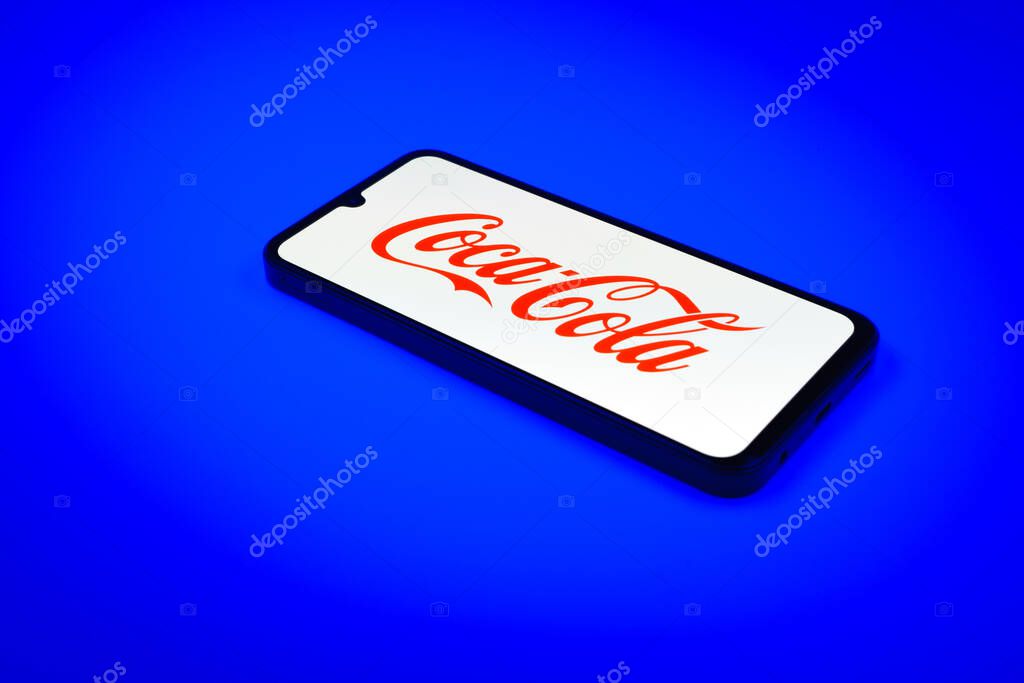 Prague, Czechia - 02 21 2025: Laptop on surface showing Coca-Cola logo.