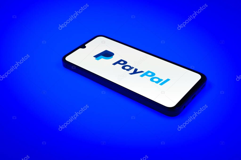 Prague, Czechia - 02 21 2025: Laptop on surface showing PayPal logo.