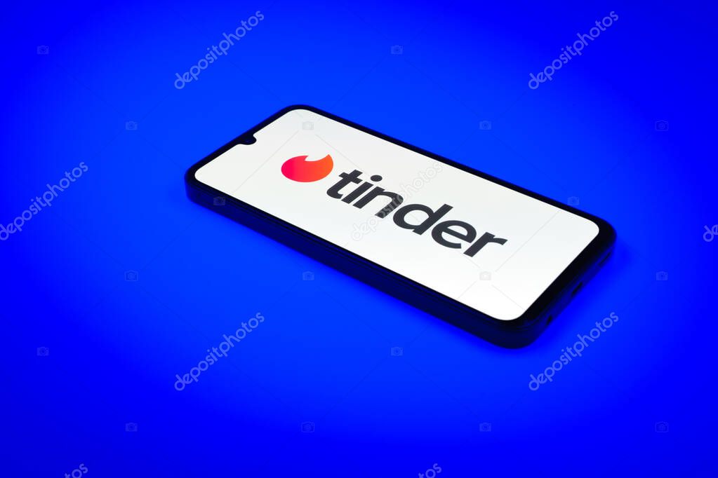 Prague, Czechia - 02 21 2025: Laptop on surface showing Tinder logo.