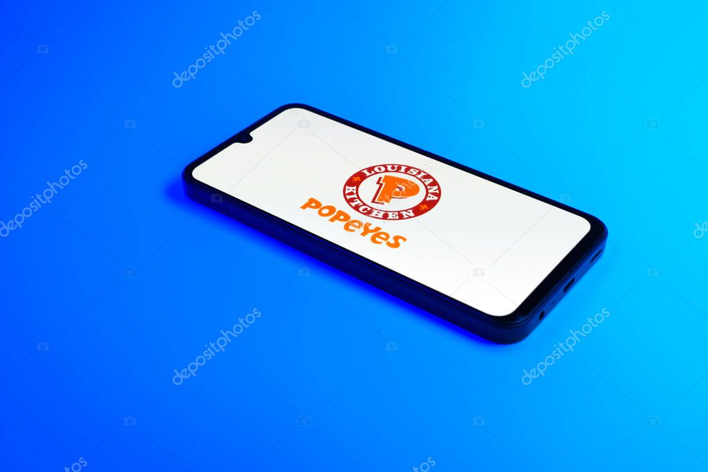 Prague, Czechia - 02 21 2025: Laptop on surface showing Popeyes logo.