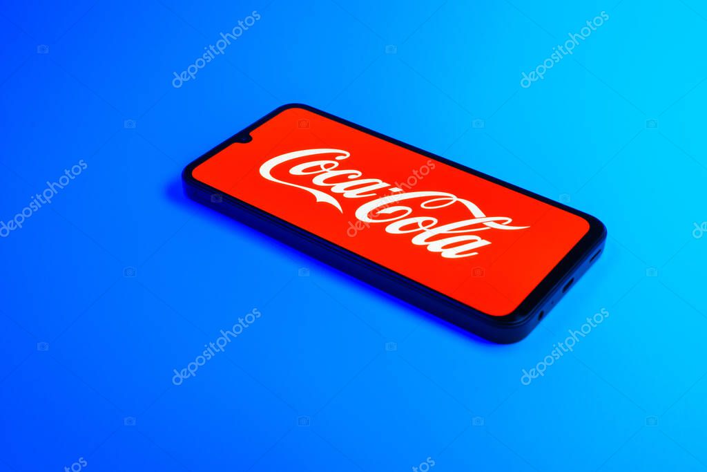 Prague, Czechia - 02 21 2025: Laptop on surface showing Coca-Cola logo.