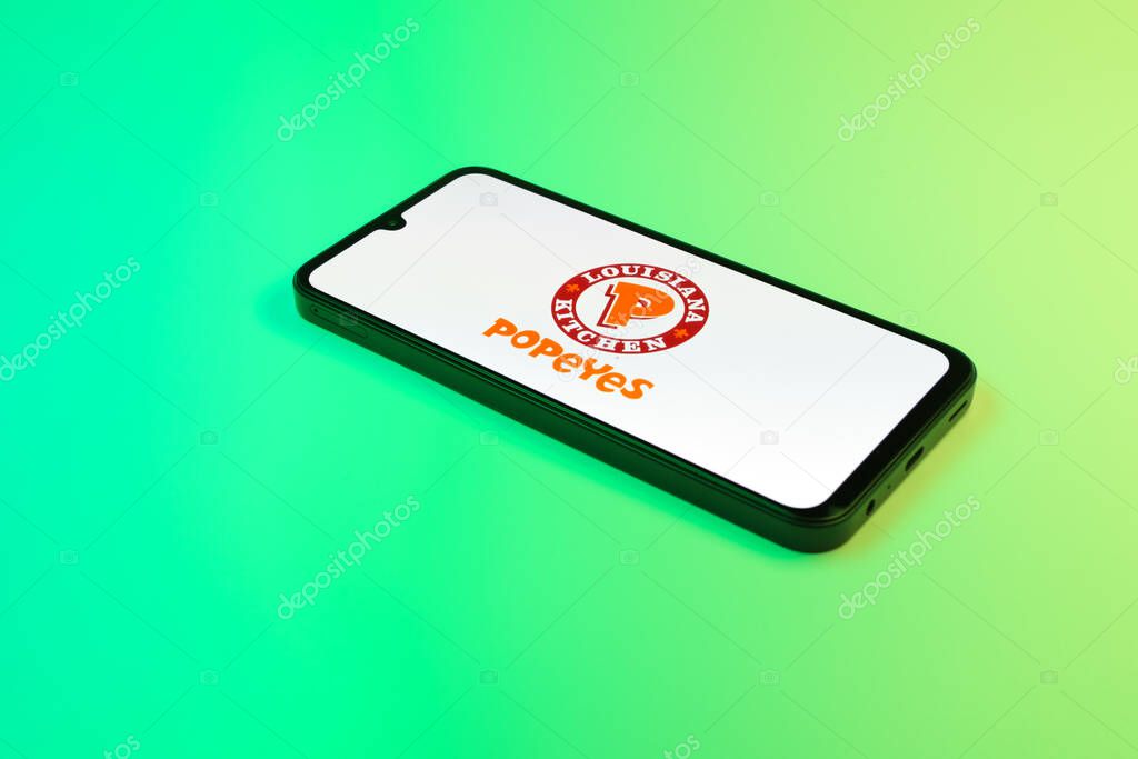 Prague, Czechia - 02 21 2025: Laptop on surface showing Popeyes logo.