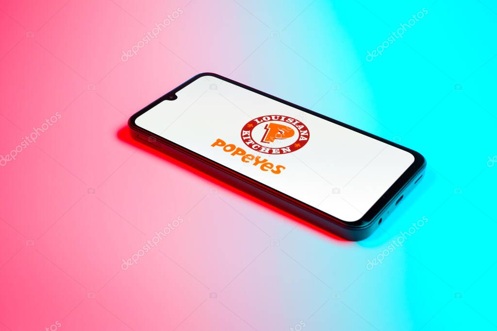 Prague, Czechia - 02 21 2025: Laptop on surface showing Popeyes logo.