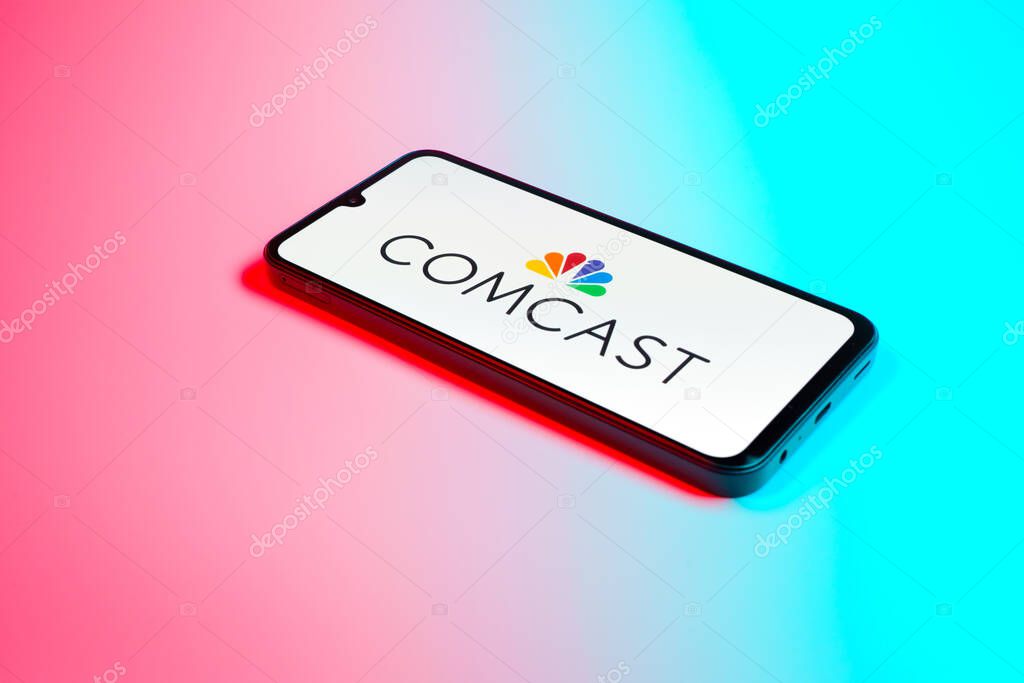 Prague, Czechia - 02 21 2025: Laptop on surface showing Comcast logo.