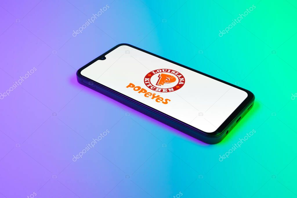 Prague, Czechia - 02 21 2025: Laptop on surface showing Popeyes logo.