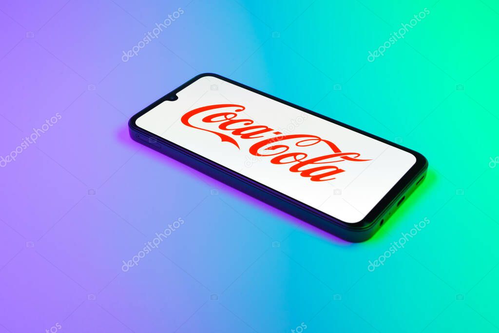 Prague, Czechia - 02 21 2025: Laptop on surface showing Coca-Cola logo.