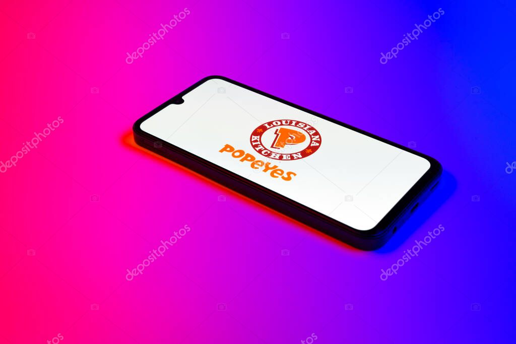 Prague, Czechia - 02 21 2025: Laptop on surface showing Popeyes logo.