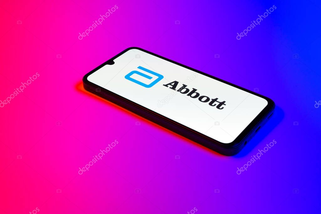 Prague, Czechia - 02 21 2025: Laptop on surface showing Abbott Laboratories logo.