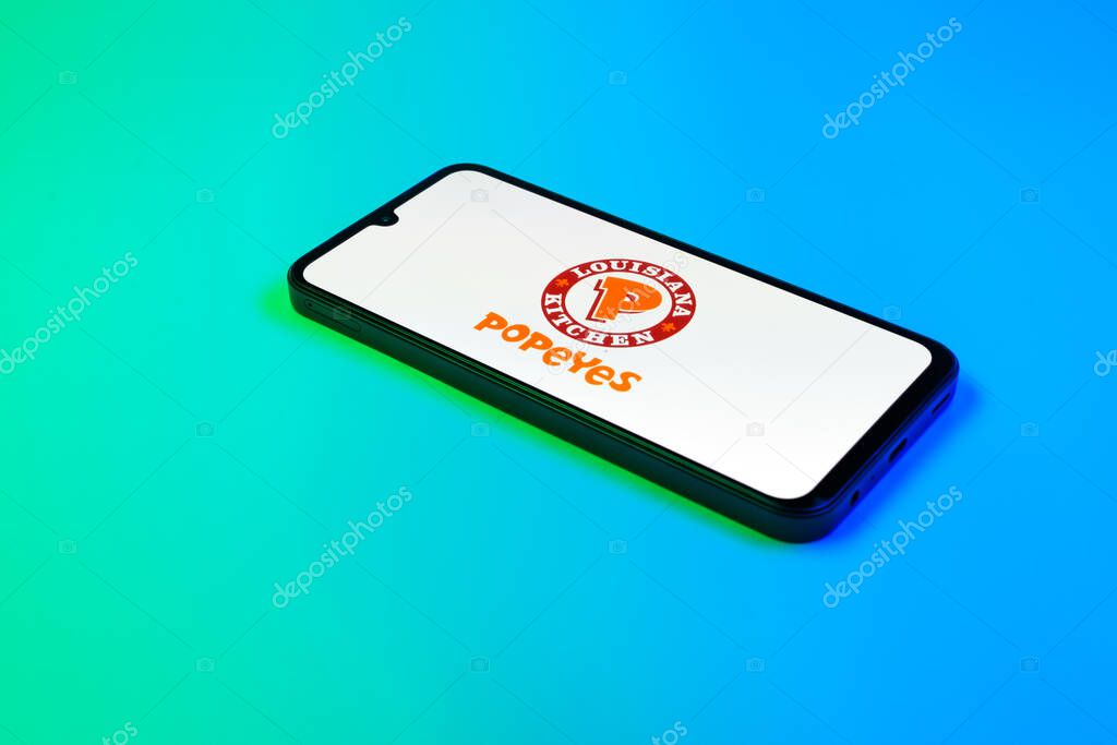 Prague, Czechia - 02 21 2025: Laptop on surface showing Popeyes logo.