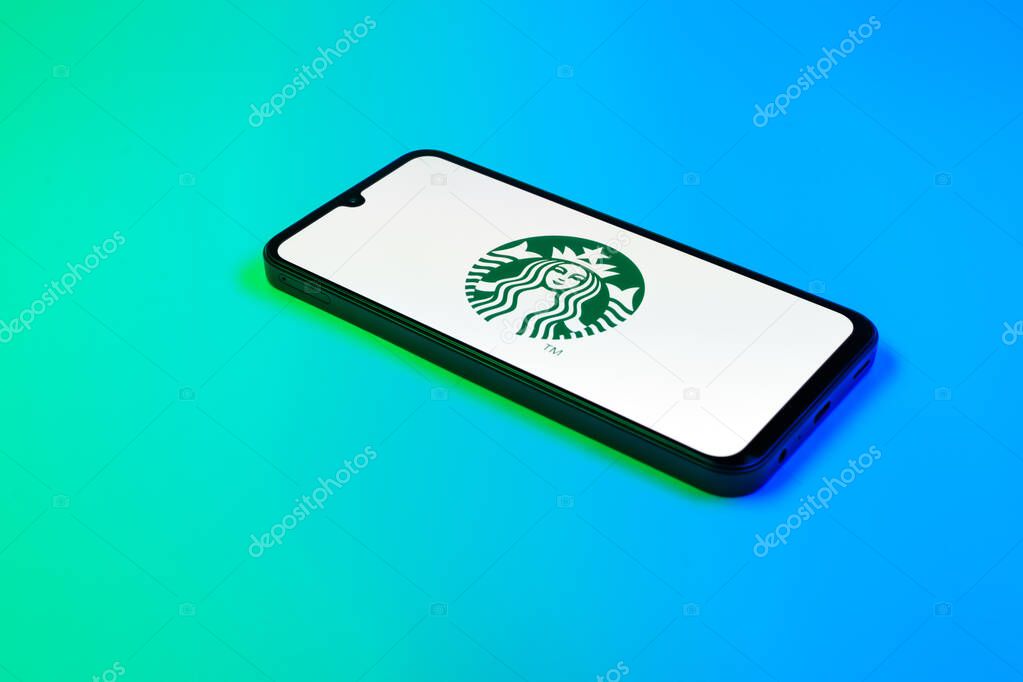 Prague, Czechia - 02 21 2025: Laptop on surface showing Starbucks logo.