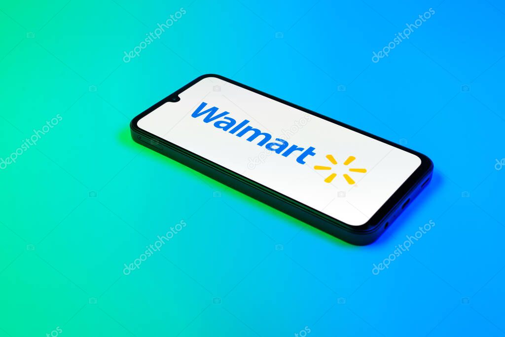 Prague, Czechia - 02 21 2025: Laptop on surface showing Walmart logo.