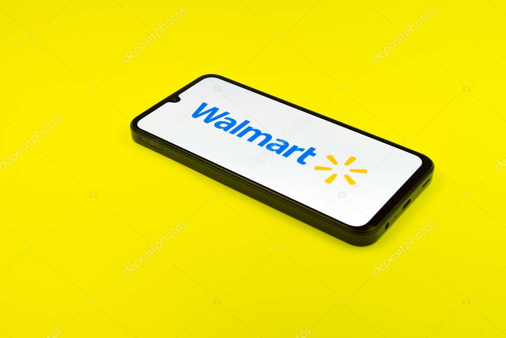 Prague, Czechia - 02 21 2025: Laptop on surface showing Walmart logo.