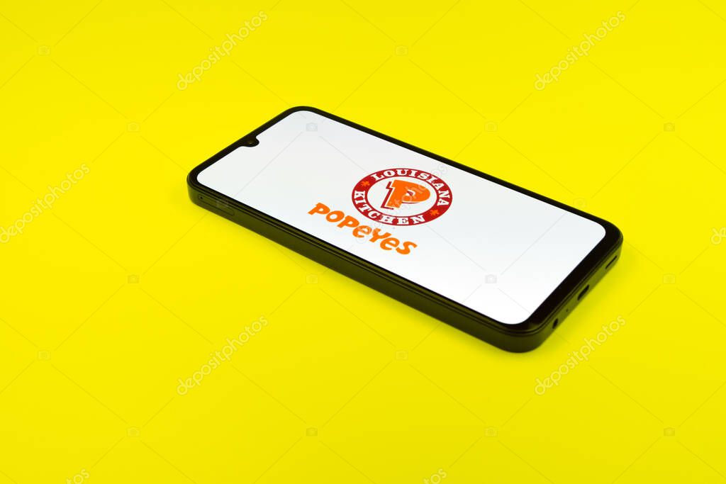 Prague, Czechia - 02 21 2025: Laptop on surface showing Popeyes logo.