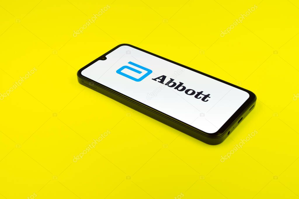 Prague, Czechia - 02 21 2025: Laptop on surface showing Abbott Laboratories logo.