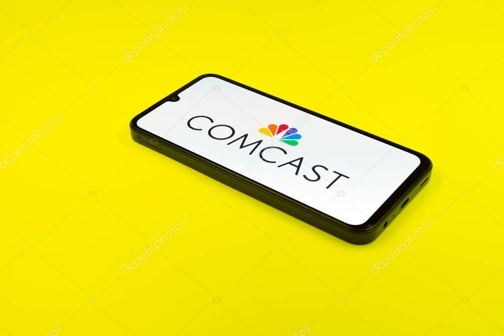 Prague, Czechia - 02 21 2025: Laptop on surface showing Comcast logo.