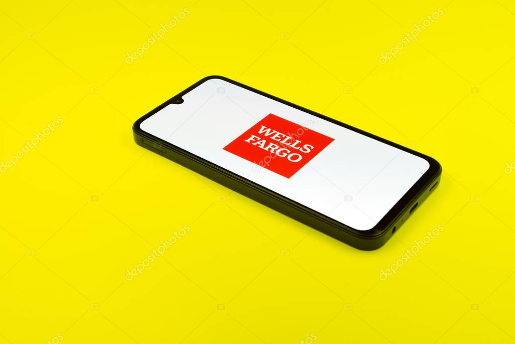 Prague, Czechia - 02 21 2025: Laptop on surface showing Wells Fargo logo.
