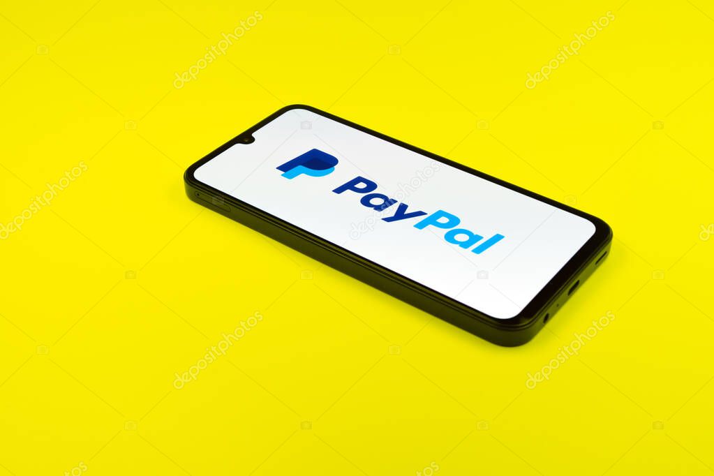 Prague, Czechia - 02 21 2025: Laptop on surface showing PayPal logo.