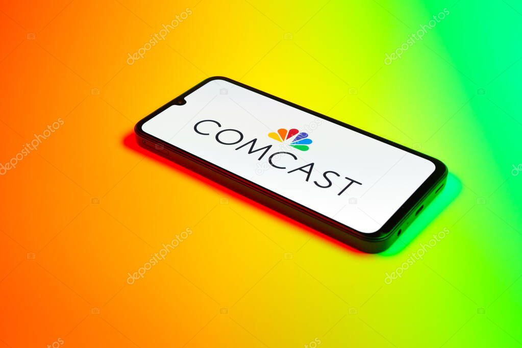 Prague, Czechia - 02 21 2025: Laptop on surface showing Comcast logo.