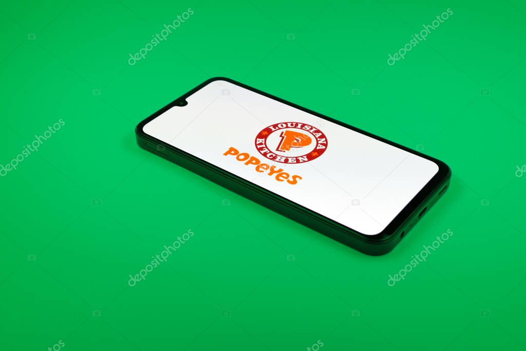 Prague, Czechia - 02 21 2025: Laptop on surface showing Popeyes logo.