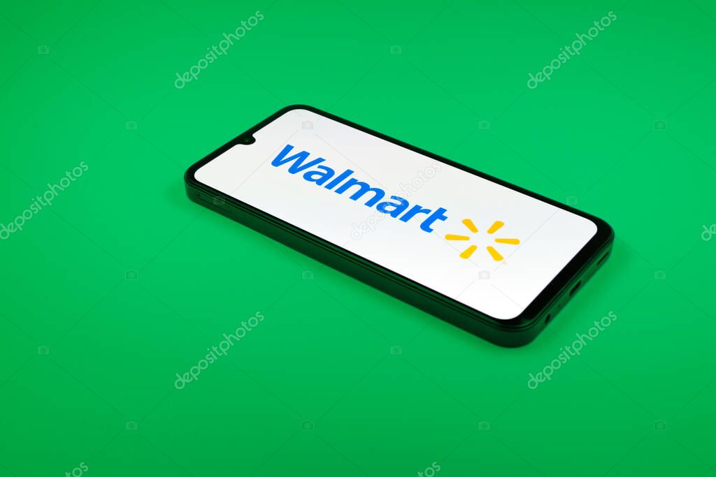 Prague, Czechia - 02 21 2025: Laptop on surface showing Walmart logo.