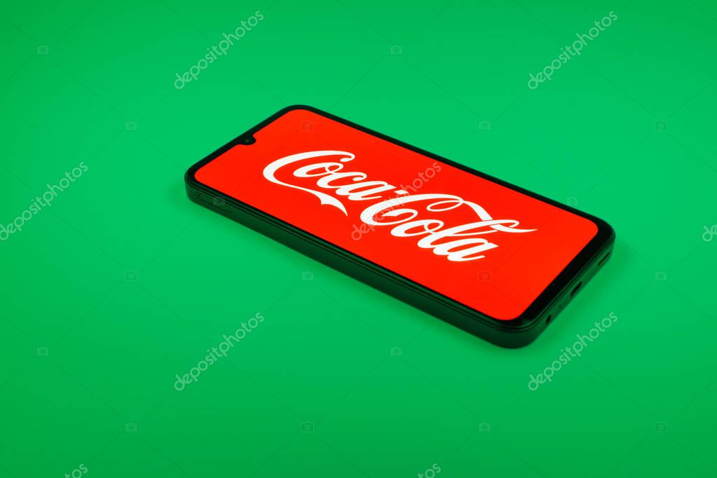 Prague, Czechia - 02 21 2025: Laptop on surface showing Coca-Cola logo.
