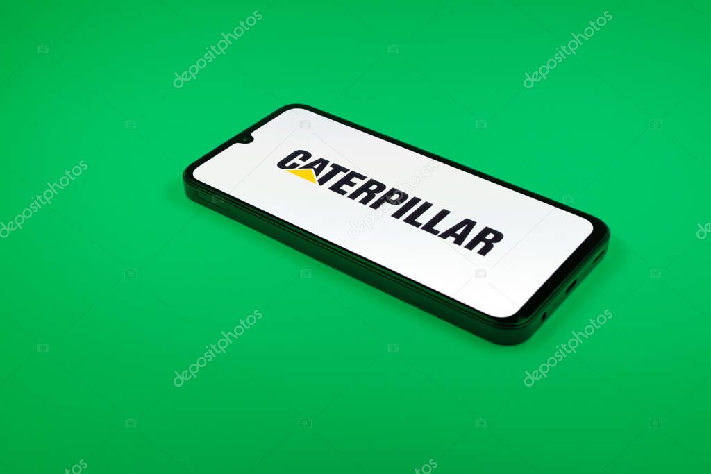 Prague, Czechia - 02 21 2025: Laptop on surface showing Caterpillar logo.
