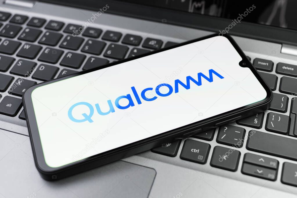 Prague, Czechia - 02 21 2025: Laptop on surface showing Qualcomm logo.