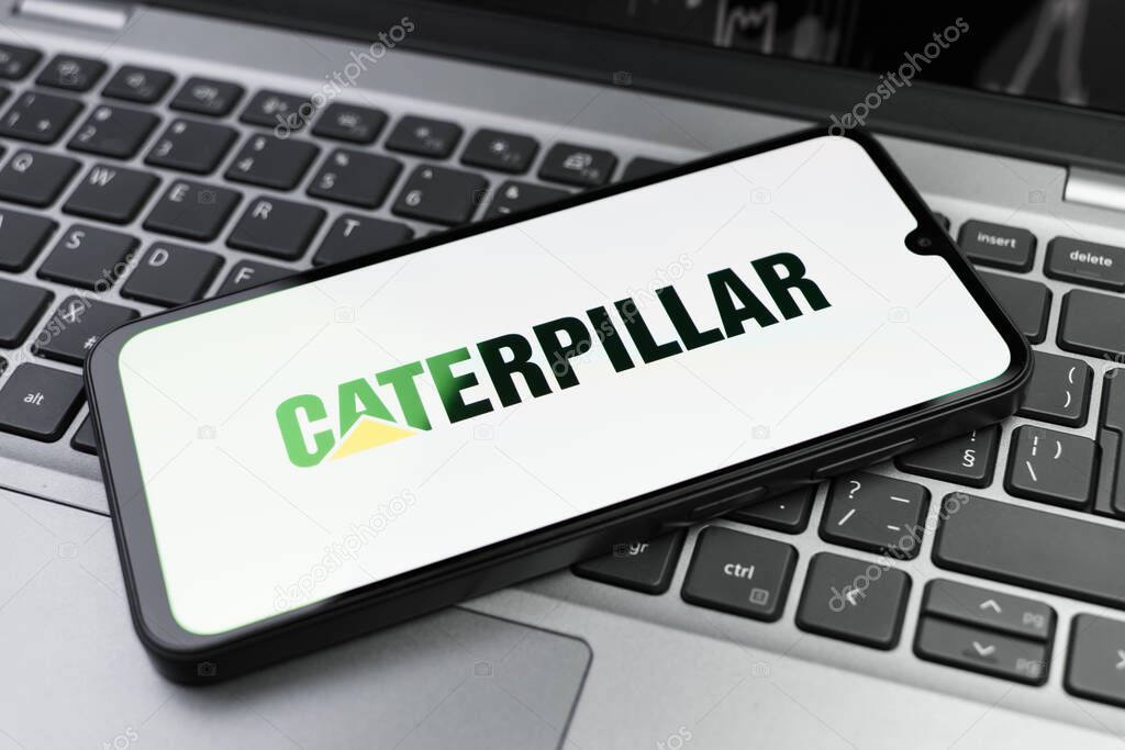 Prague, Czechia - 02 21 2025: Laptop on surface showing Caterpillar logo.