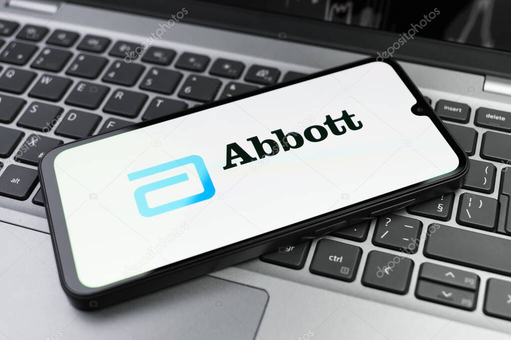 Prague, Czechia - 02 21 2025: Laptop on surface showing Abbott Laboratories logo.