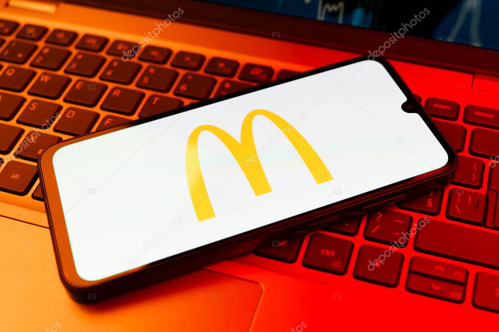 Prague, Czechia - 02 21 2025: Laptop on surface showing McDonalds logo.