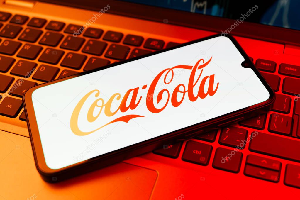 Prague, Czechia - 02 21 2025: Laptop on surface showing Coca-Cola logo.