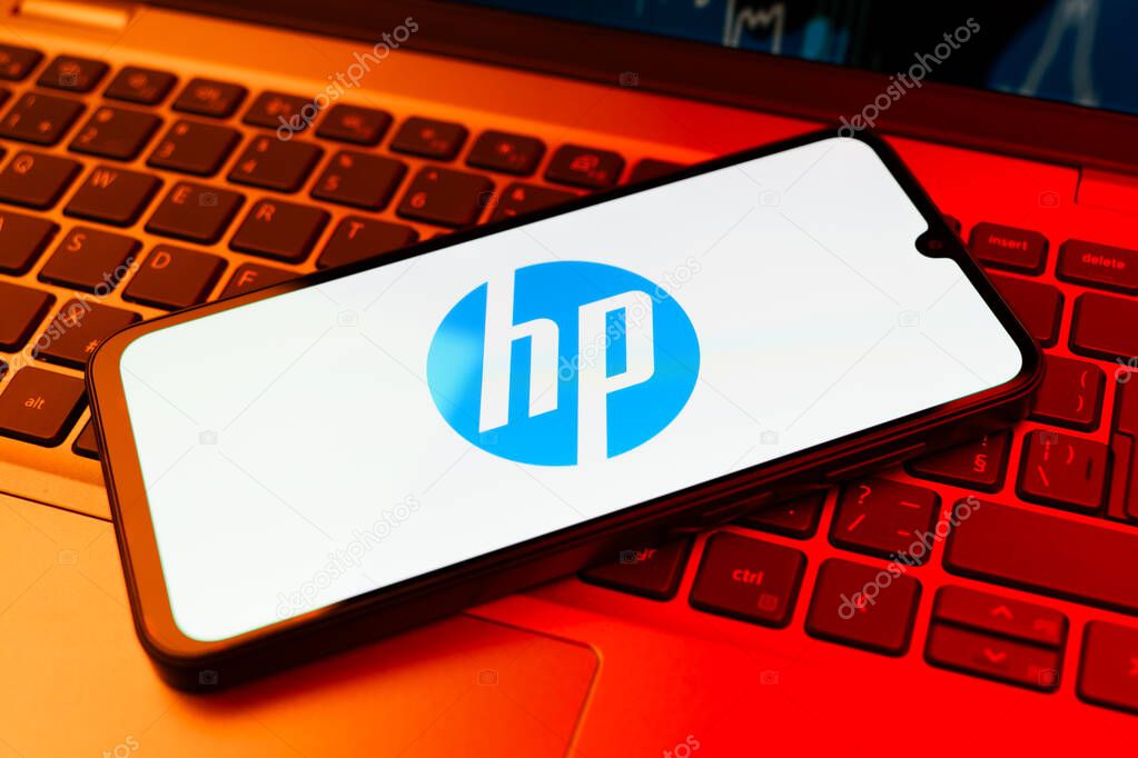 Prague, Czechia - 02 21 2025: Laptop on surface showing Hewlett-Packard logo.
